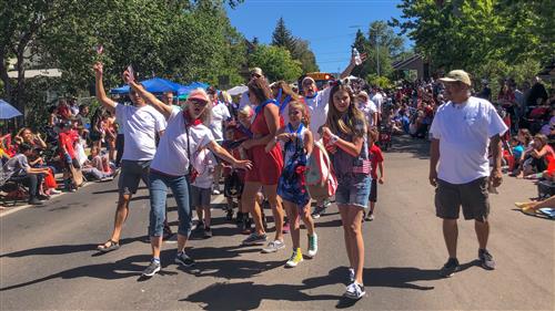Staff and families of FUSD pose together in the 4th of July parade 