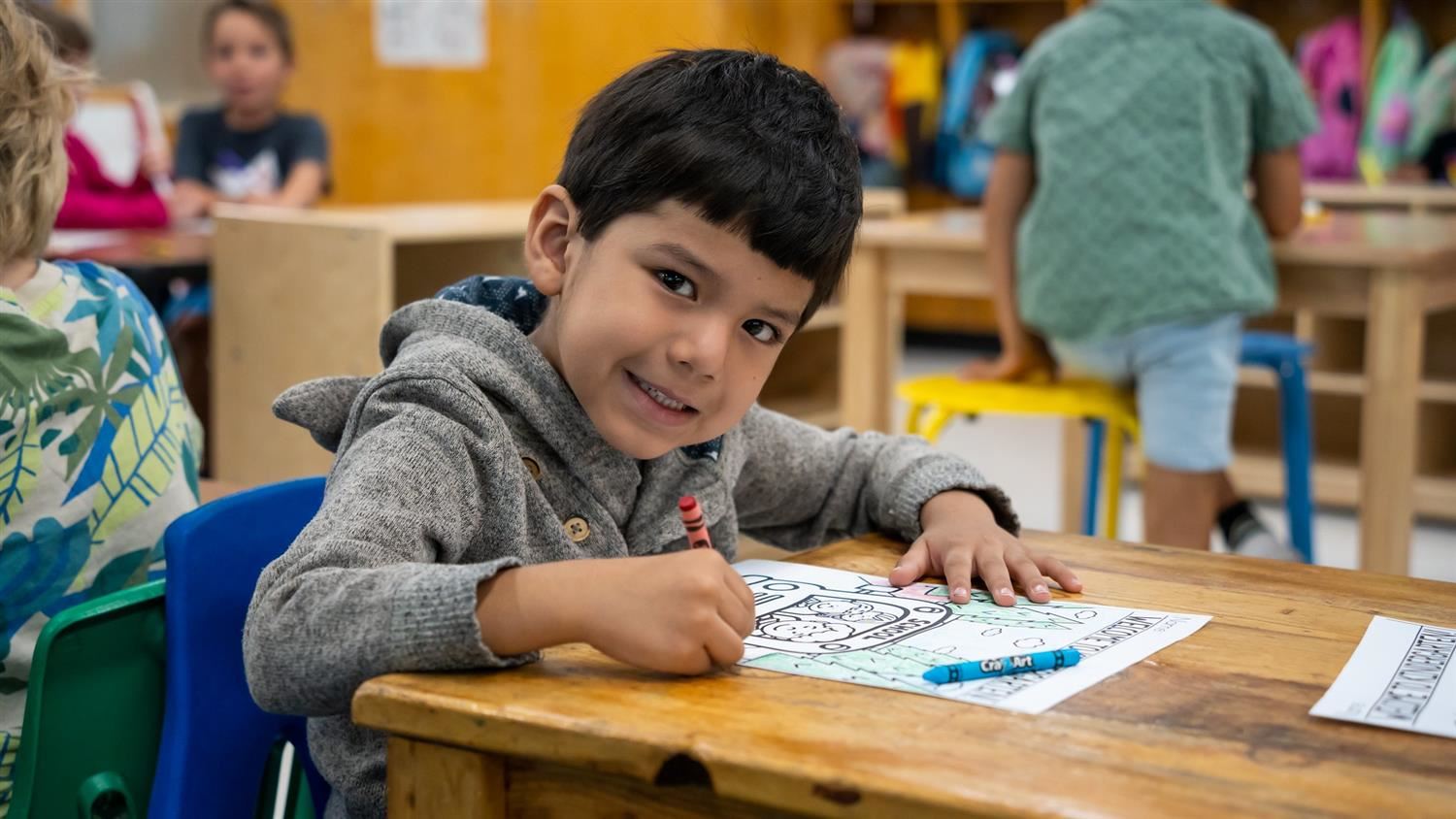 Kindergarten student smiling at camera Kindergarten student smiling at camera