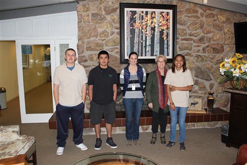 Students pose with teacher at the continental project