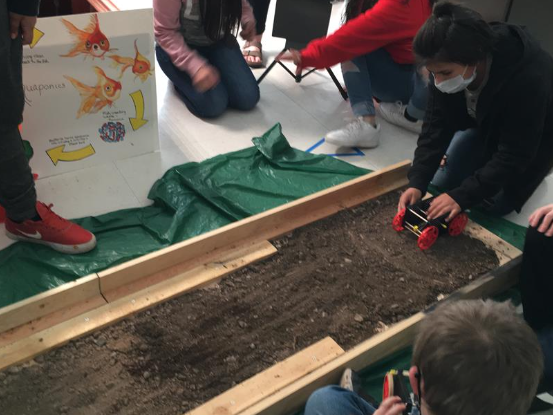 students create wagons to travel over dry and wet land